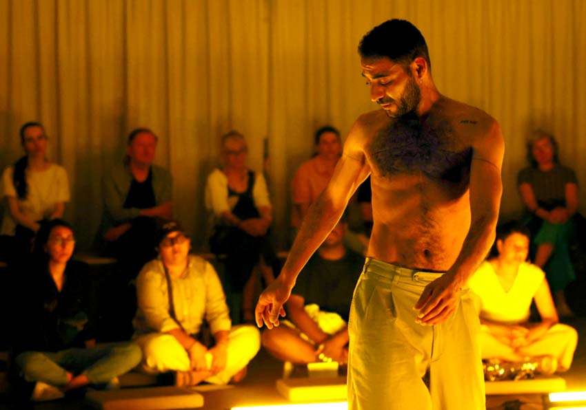 A man performing in front of an audience